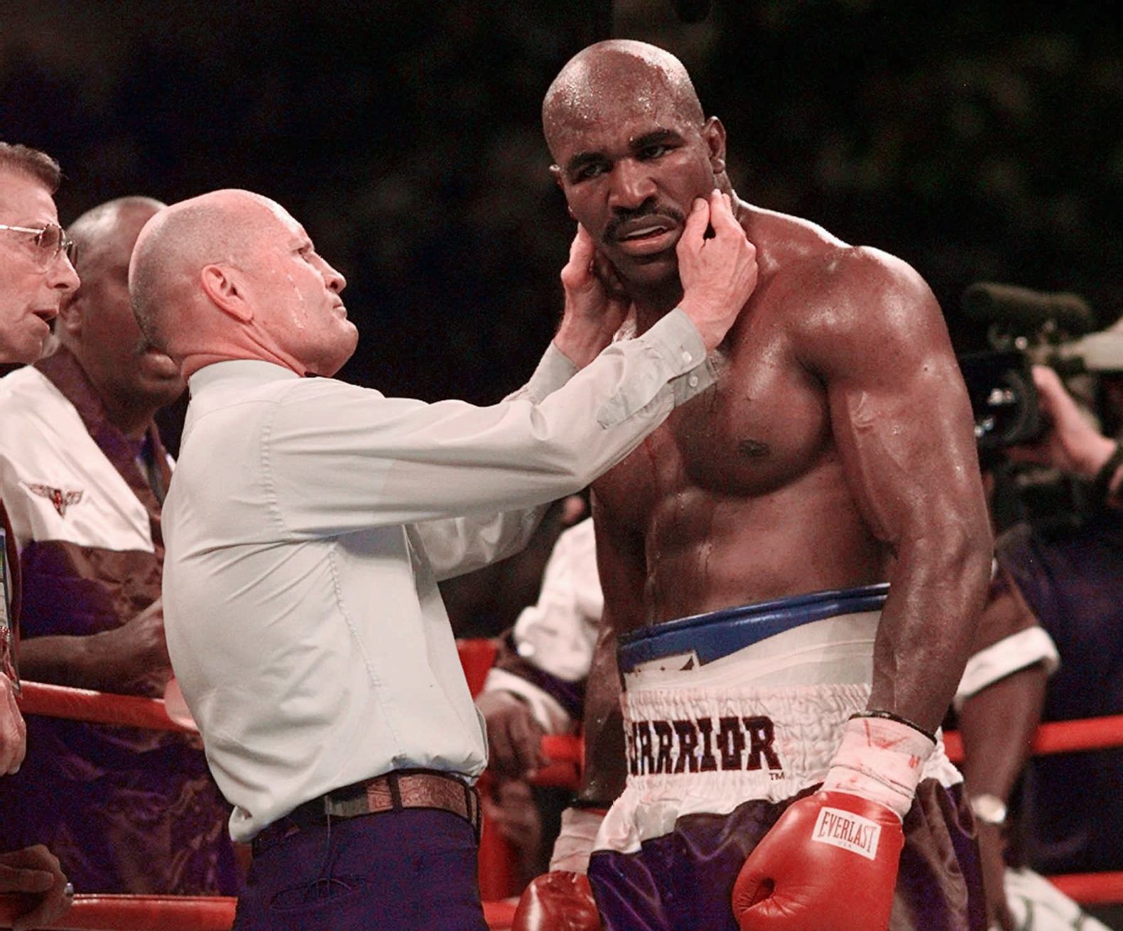 1997: Evander Holyfield wins after being bitten on ear by Mike Tyson